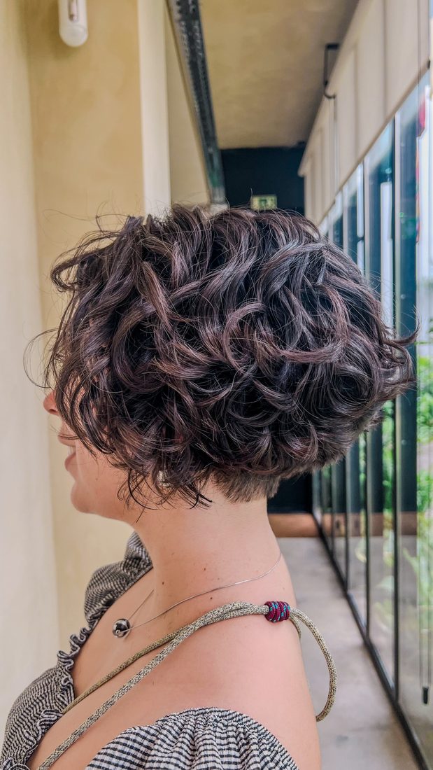 A short curly bob with defined dark curls